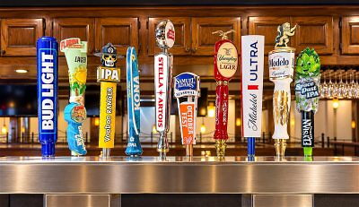 Several draft beer taps at a bar